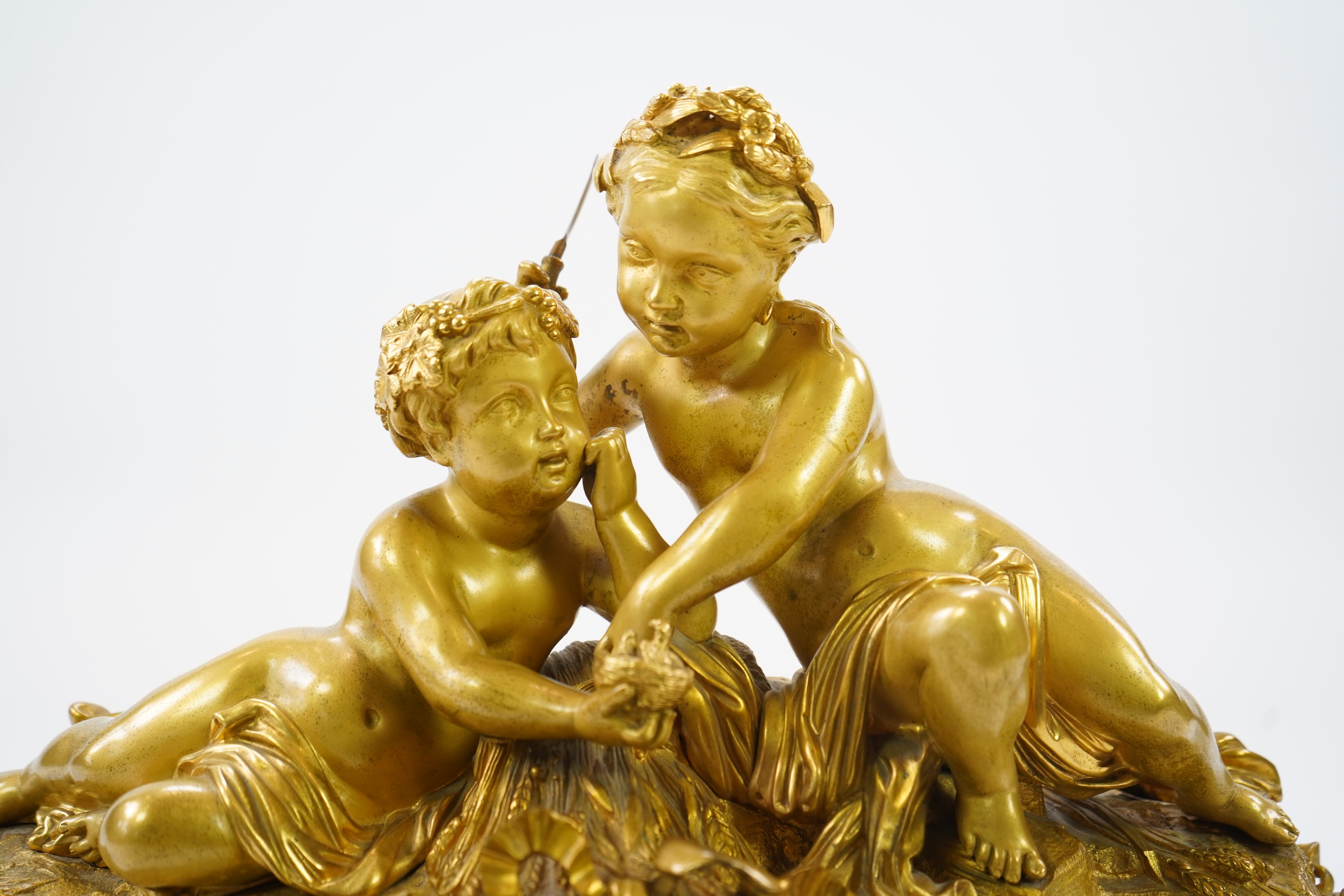 A late 19th century French gilt bronze figural mantel clock